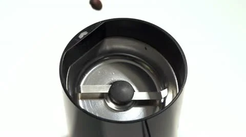 Coffee beans pouring in coffee mill slow motion Vidéo 21243317