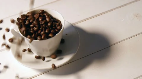 Coffee beans pouring into cup, slow motion Stock Footage 48468818