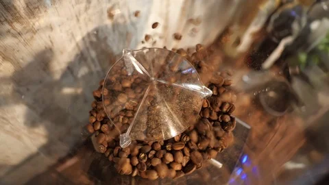 Coffee beans pouring into the grinder Stock Footage 122384974