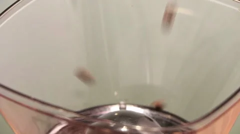 Coffee Beans pouring into a Grinder Hopper - High Angle Stock Footage 61404985