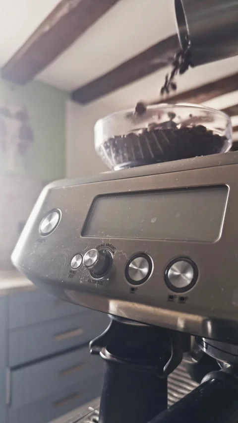 Coffee Beans Pouring Into Machine Hopper in Slow Motion Видео 328994888