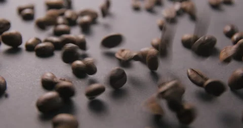 Coffee beans pouring slow motion in studio 4K pro res Video stock 273635155