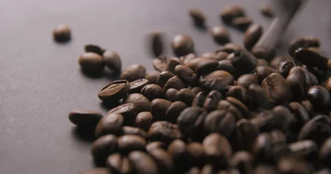 Coffee beans pouring slow motion in studio 4K pro res Stock Footage 273635369