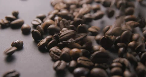 Coffee beans pouring slow motion in studio 4K pro res Video stock 273635465