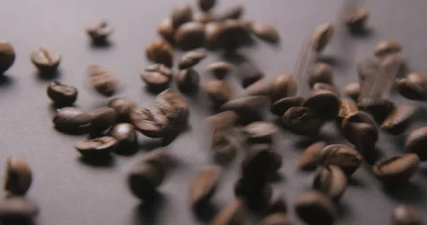 Coffee beans pouring slow motion in studio 4K pro res Video stock 273635579