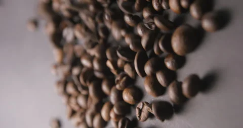 Coffee beans pouring slow motion in studio 4K pro res vertical Video stock 273635696