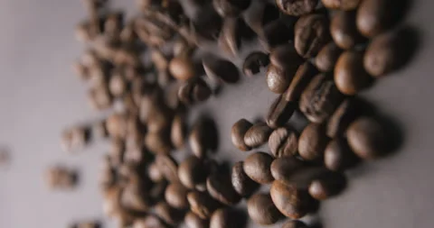 Coffee beans pouring slow motion in studio 4K pro res vertical Stock Footage 273635737