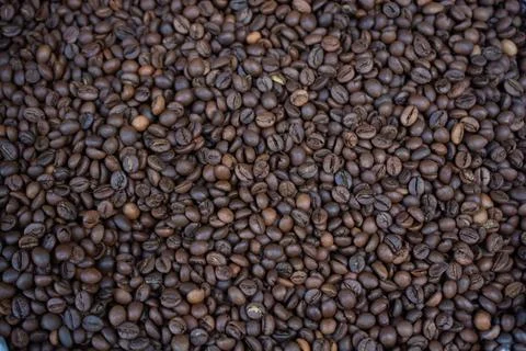 Coffee beans ready for the grinder background Stock-Fotos