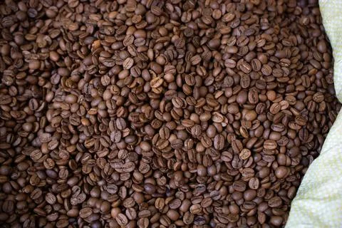 Coffee beans ready for the grinder background Stock Photos