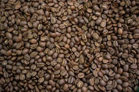 Coffee beans ready for the grinder background Stock Photos