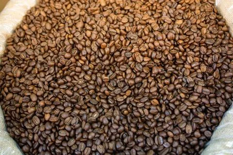 Coffee beans ready for the grinder background Stock-Fotos
