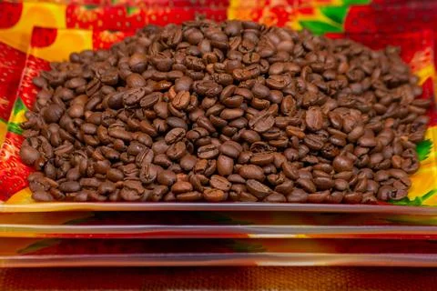 Coffee beans roasted on a ceramic rectangular plate Stock Photos