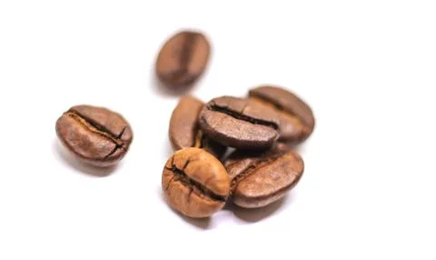Coffee beans roasted close-up. Isolate Selective focus. Stock Photos