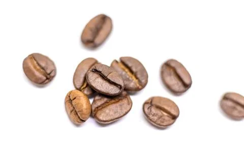Coffee beans roasted close-up. Isolate Selective focus. Stock Photos