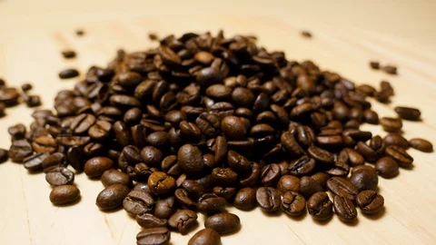 Coffee beans roasted. Close up of seeds of coffee. 4K Stock Footage 128591510