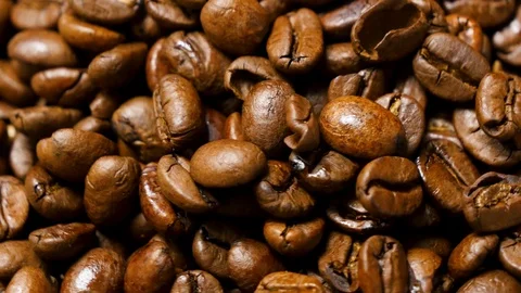 Coffee beans roasted. Close up of seeds of coffee. 4K Stock Footage 128592450