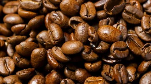 Coffee beans roasted. Close up of seeds of coffee. 4K Stock Footage 128592635