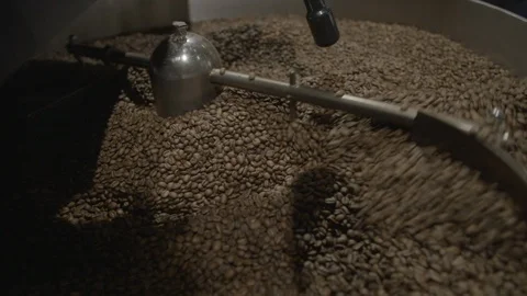 Coffee beans roasted in a coffee roasting machine Stock Footage 87612523