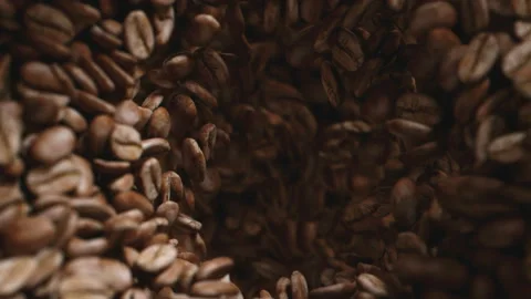 Coffee beans roasted in grinder falling into the interior of the machine Stock Footage 163139354