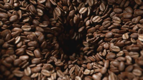 Coffee beans roasted in grinder falling into the interior of the machine Stock Footage 163139387