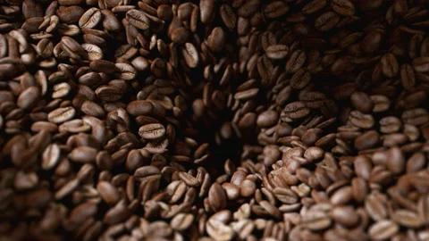 Coffee beans roasted in grinder falling into the interior of the machine Stock Footage 163139404