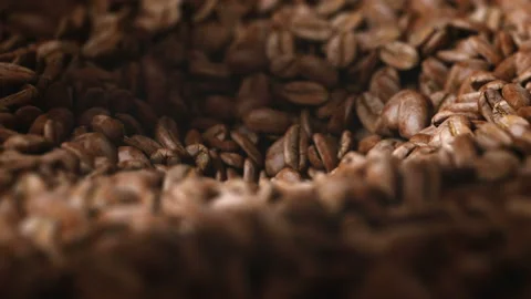 Coffee beans roasted in grinder falling into the interior of the machine Stock Footage 163266570