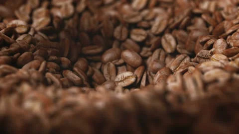 Coffee beans roasted in grinder falling into the interior of the machine Stock Footage 163266741
