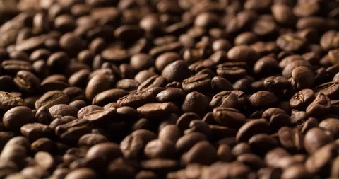 Coffee beans roasted rotating blurry background medium shot Stock Footage 98026157