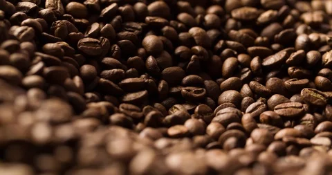 Coffee beans roasted rotating looped blurry background medium shot Stock Footage 98029344