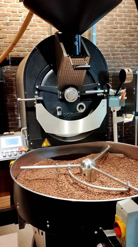 Coffee beans in a roaster machine. Vertical video Stock Footage 219958846