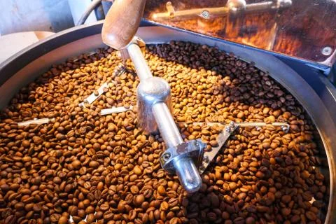 Coffee beans on the roasting machine Stock Photos