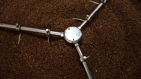 Coffee beans roasting process with roasting machine.	 Stock Footage 209528927