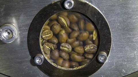 Coffee beans roasting in roaster; window view Stock Footage 69869523