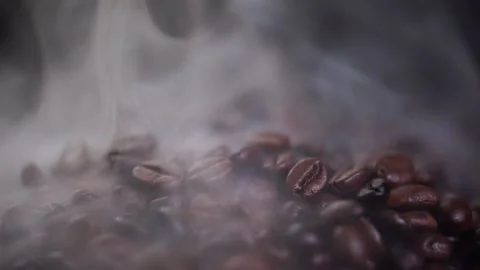 Coffee beans roasting with smoke,  selective focus, and soft focus. Stock Footage 241432305