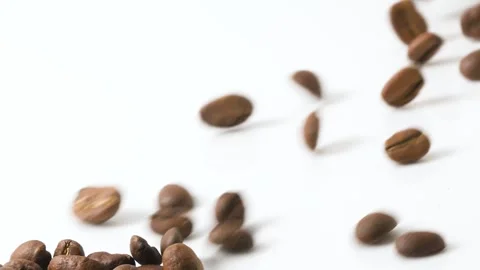 Coffee beans Rolling down on white background Stock Footage 258765360