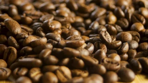 The coffee beans rotate in a circle. Close-up coffee pattern Stock Footage 316089933