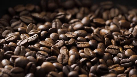 Coffee beans rotate on the pan Stock Footage 120982507