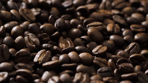 Coffee beans rotate on the pan Stock Footage 120982654