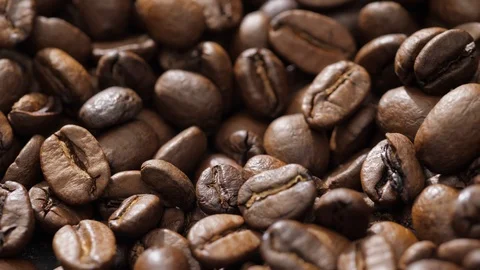 Coffee beans rotate on the pan Stock Footage 120982908