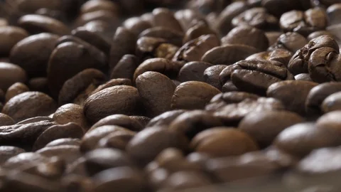 Coffee beans rotate on the pan Stock Footage 120983157