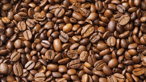 Coffee beans rotate on the pan Stock Footage 120985148