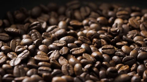 Coffee beans rotate on the pan Stock Footage 121539647
