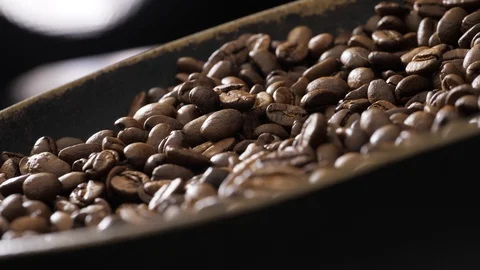 Coffee beans rotate on the pan Stock Footage 121540388