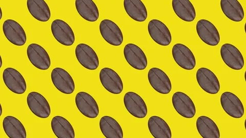 Coffee beans rotate in synchronized rows on a vivid yellow background, creating Stock Footage 341406345
