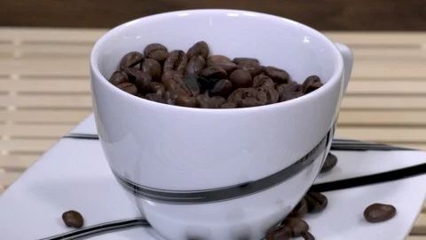 Coffee beans in rotating black and white cup Stock-Footage 88256138