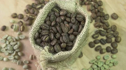 Coffee beans rotating in burlap, close up Stock Footage 67902681