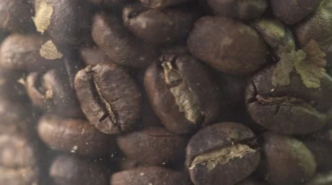 Coffee beans rotating in jar close up macro shot Stock Footage 67906811