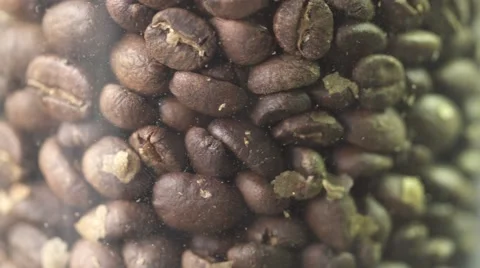 Coffee beans rotating in jar close up macro shot Vídeos de archivo 67938800