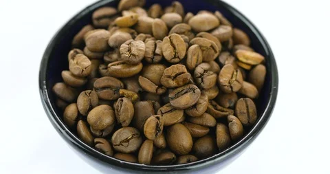 Coffee beans rotating on white background Stock Footage 102399666