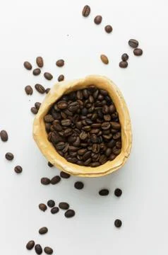 Coffee beans in a rustic bowl Stock Photos